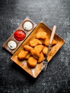 Chicken nuggets with different sauces.